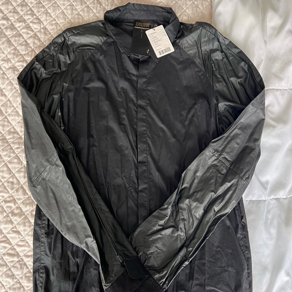 DAMAGED GOOD BY SONGS OF HEREOS Black shirt with leather like sleeves. W/ tags